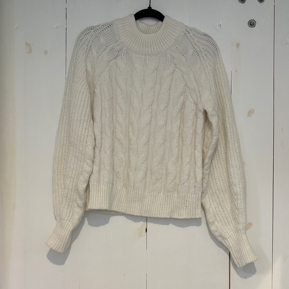 Cream colored cable knit sweater